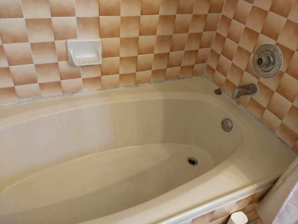 Clean bathtub with stains removed after cleaning